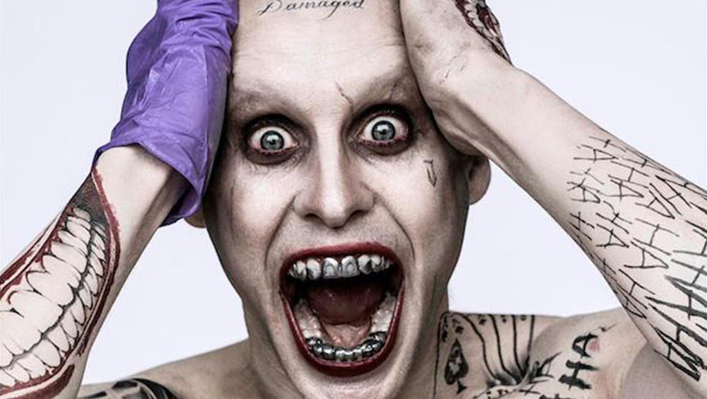 Joker shows off metal teeth