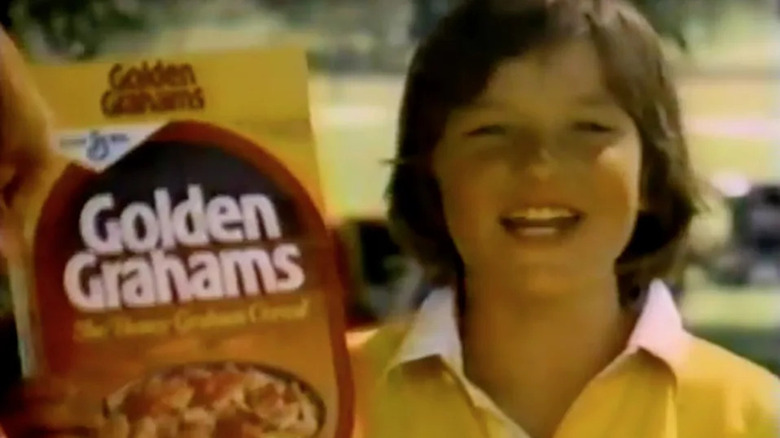 Jason Bateman holding Golden Grahams box