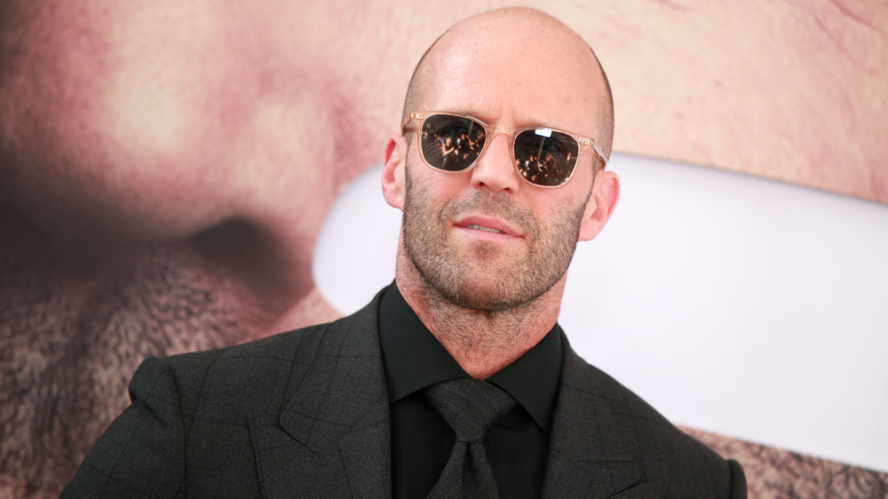 Jason Statham wearing glasses