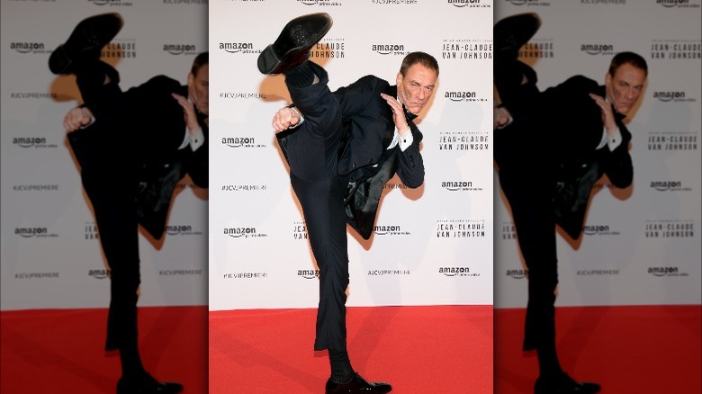 Jean-Claude Van Damme high kick in tuxedo