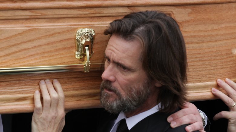 Jim Carrey carrying coffin