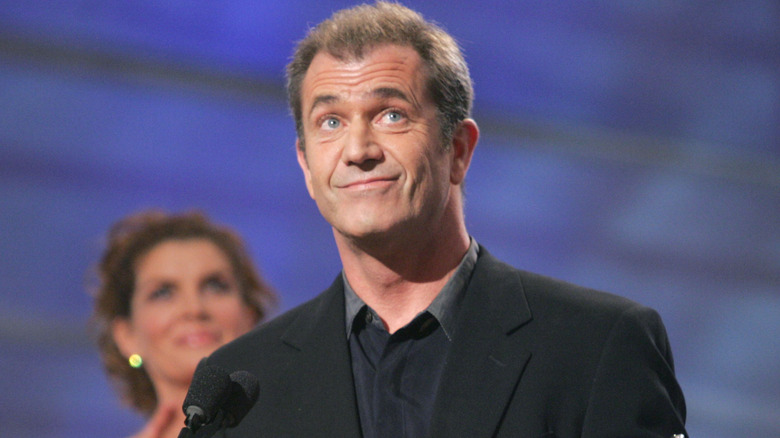 Mel Gibson smiling on stage