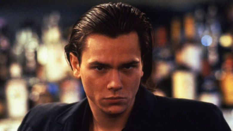 River Phoenix stares intensely