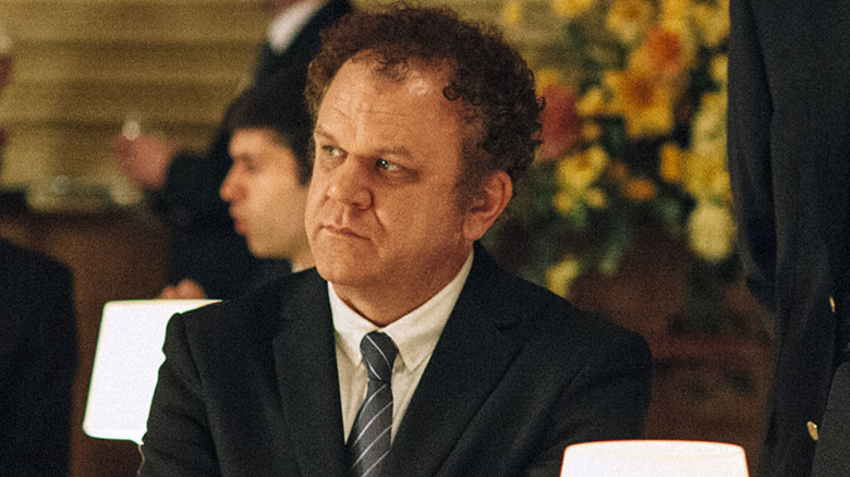 John C. Reilly wearing suit