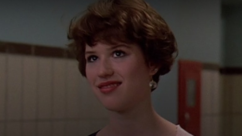 Molly Ringwald looking up smiling 