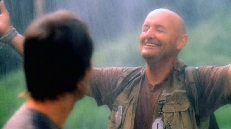 John Locke smiling in rain