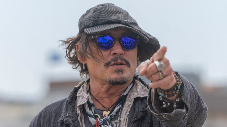 Johnny Depp pointing in sunglasses