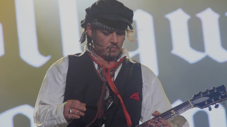 Johnny Depp playing guitar