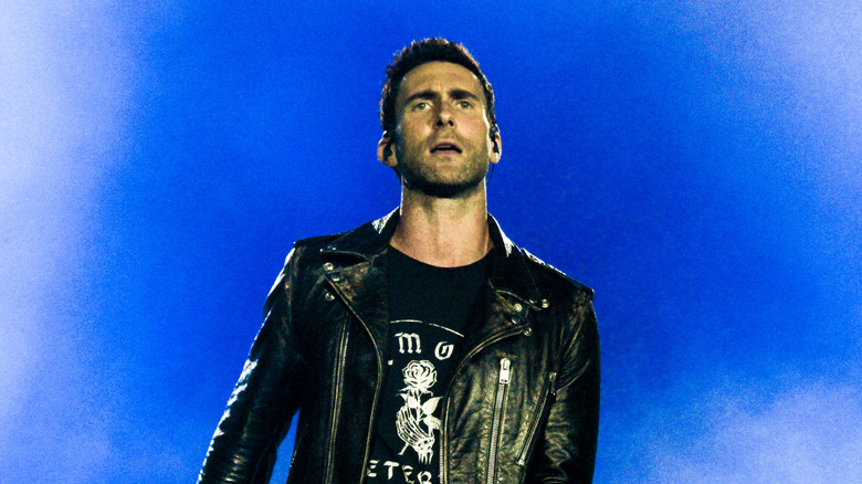 Adam Levine wearing leather jacket