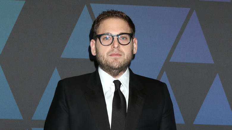 Jonah Hill wearing black suit