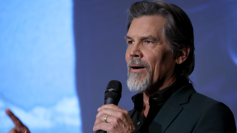 Josh Brolin talking on the mic