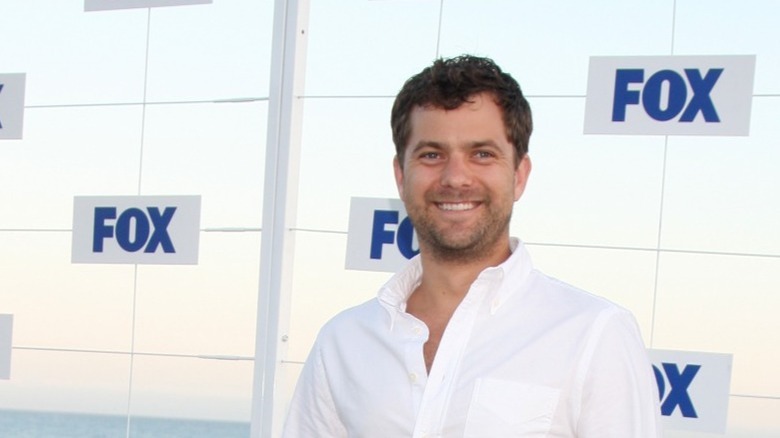 Joshua Jackson smiling outdoors