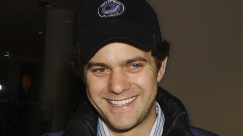 Joshua Jackson smiling in hat