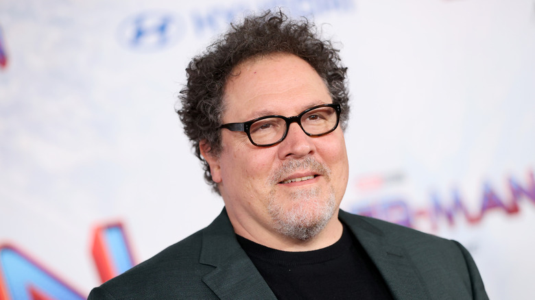 favreau grinning at the No Way Home red carpet