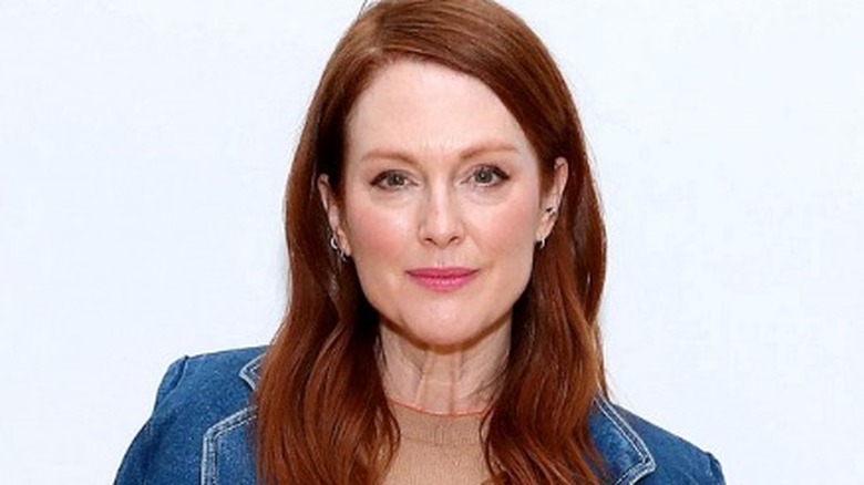 Julianne Moore posing in denim jacket 