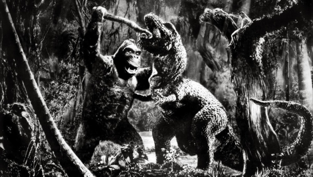 King Kong fighting a tyrannosaurus