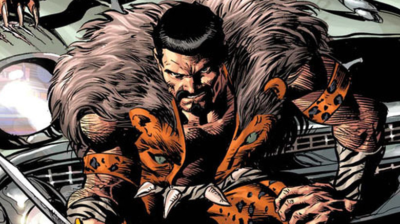 kraven brandishes knife while sitting on car