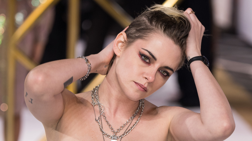 Stewart isn't quiet about criticism over not "smiling in photographs"