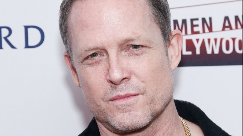 Dean Winters poses