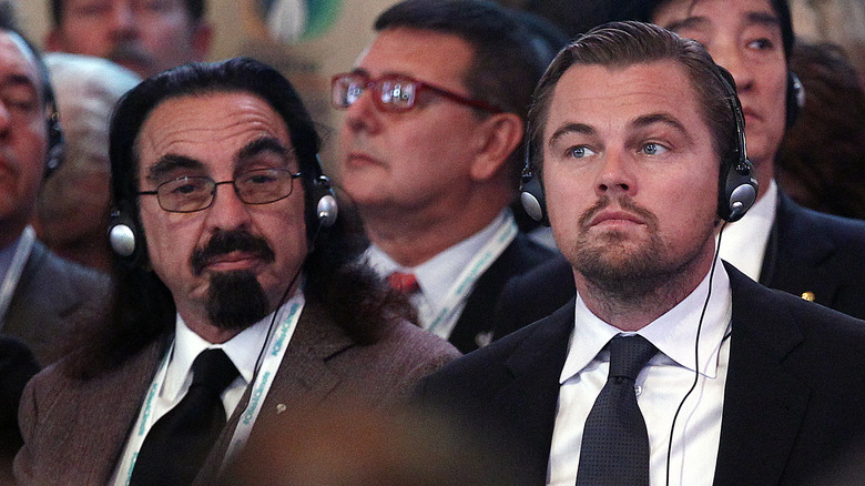 George and Leonardo DiCaprio with headphones