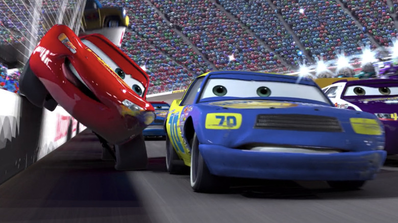 Lightning squeezes past an opponent in "Cars"