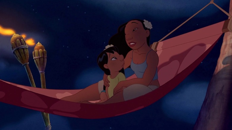 Lilo and Nani sharing a tender moment in a hammock