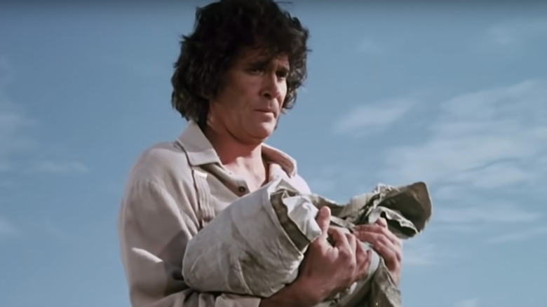 Charles Ingalls holds blanket