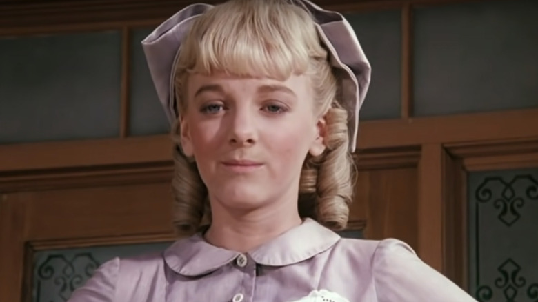 Nellie Oleson smirks