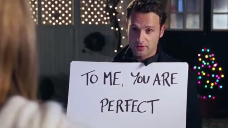 Andrew Lincoln as Mark with the signs in Love Actually