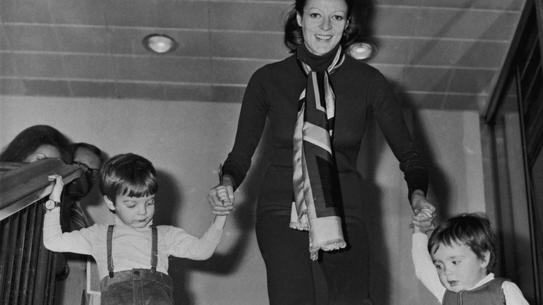 Maggie Smith with her children, walking them