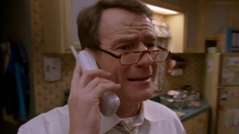 Hal looks stressed on a phonecall