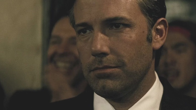 Bruce Wayne smirking