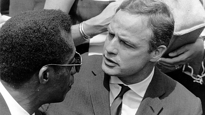 Marlon Brando James Baldwin look at each other 