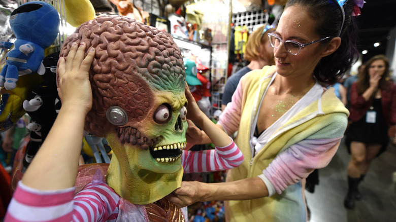 Person wearing Mars Attacks! mask