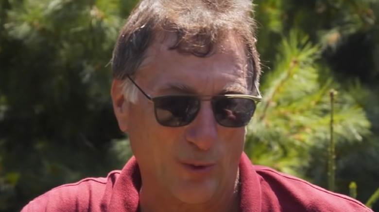 Marty Lagina in maroon shirt