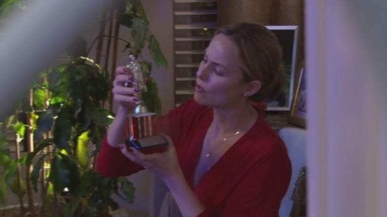 Jan Levinson fixing a trophy