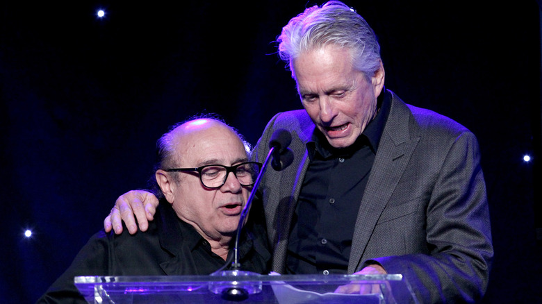 Michael Douglas with arm around Danny DeVito