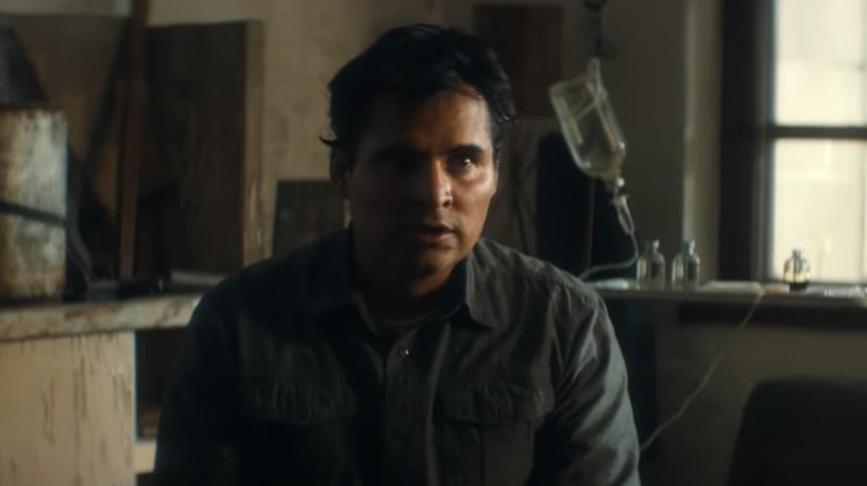 Michael Pena sits in drug lab