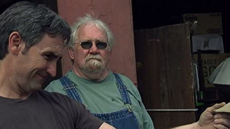 Mike Wolfe inspecting a find on American Pickers