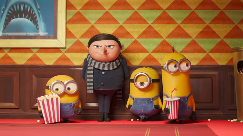 Young Gru and Minions standing in a movie theater