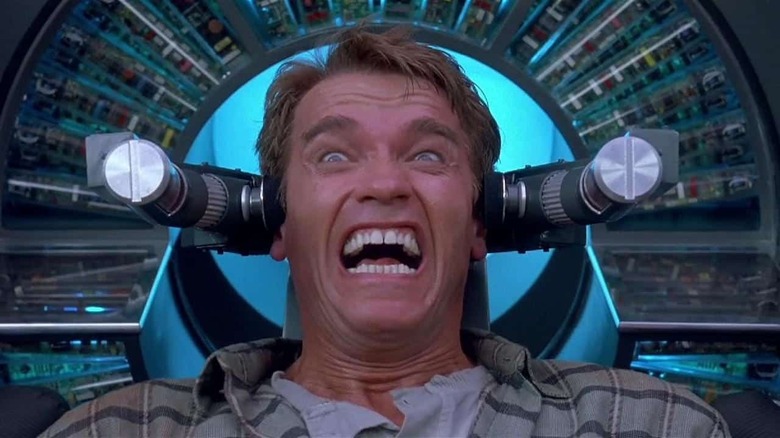 Arnold Schwarzenegger screams with device around head