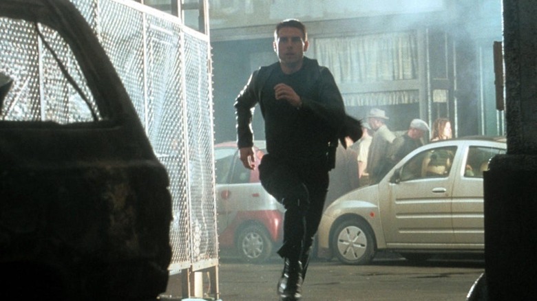 Tom Cruise runs through street