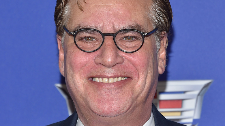 Aaron Sorkin grinning for camera