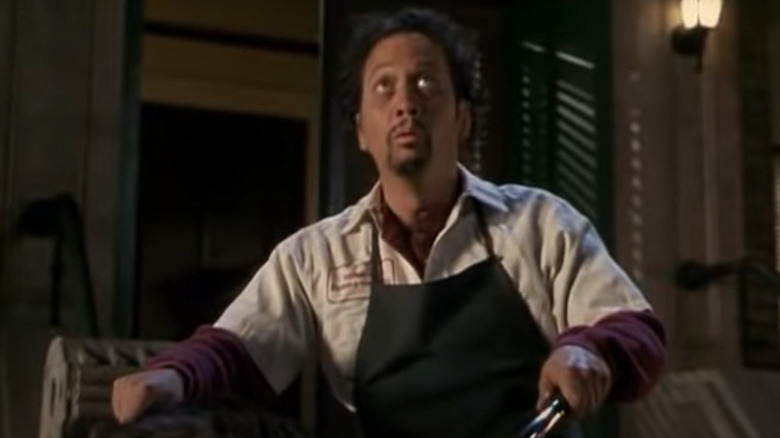 Rob Schneider in an apron