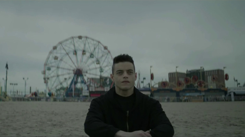 Elliot sitting in the sand