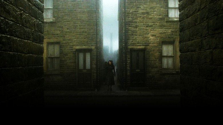 Narcissa Malfoy walking through a gloomy alley