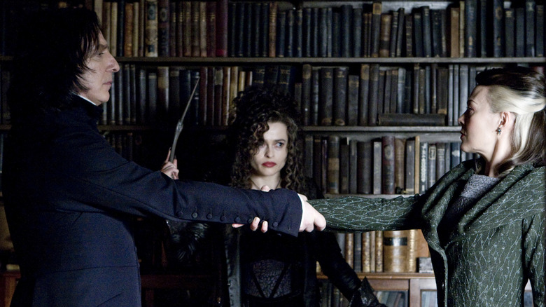 Snape and Narcissa binding their arms in the Unbreakable Vow