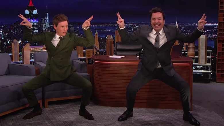 Eddie Redmayne and Jimmy Fallon squatting