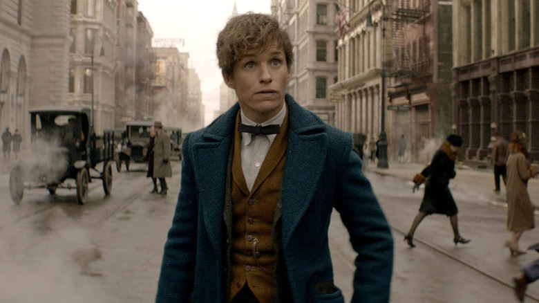 Newt Scamander walking through street