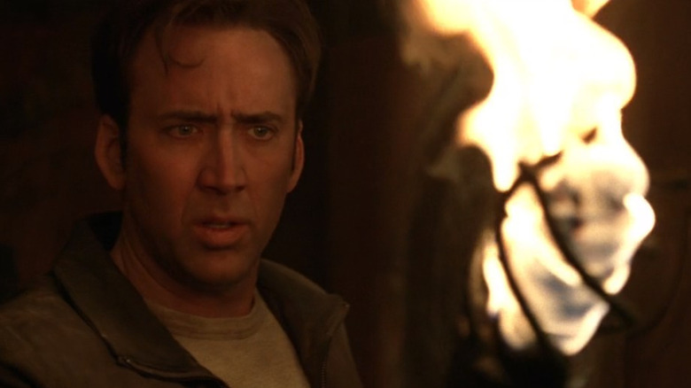 Nicolas Cage holds torch